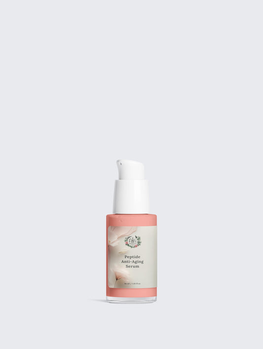 Skincare serum bottle with pink cap and label on a light gray background