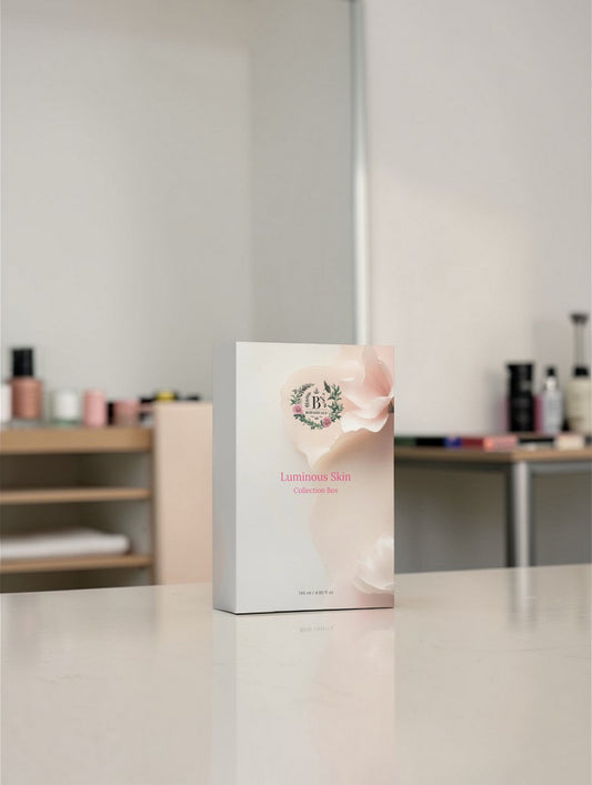 Luminous skin care collection box on marble surface.