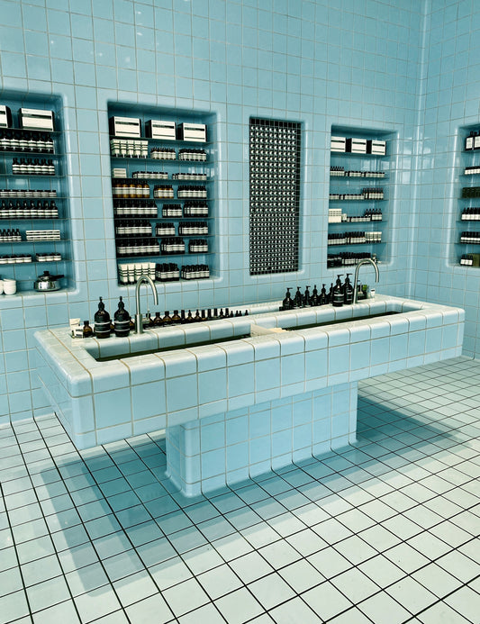 Cosmetic bottles on a tiled surface