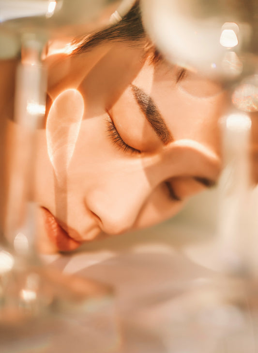 A woman in an glowing abstract setting.