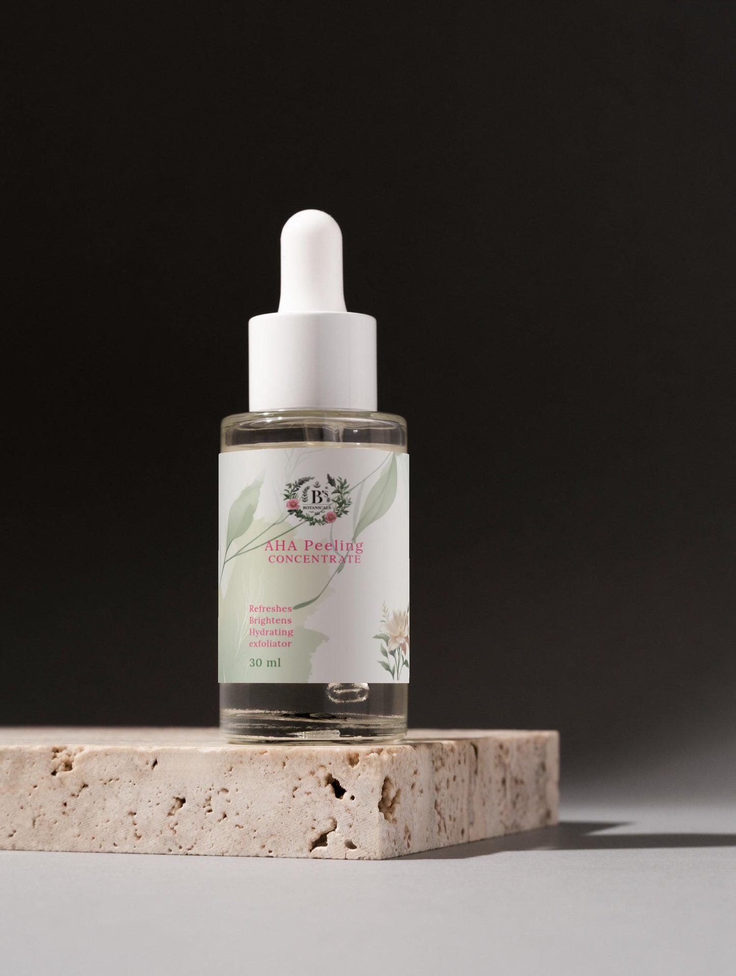 Bottle of skincare serum with dropper on a stone surface against a dark background