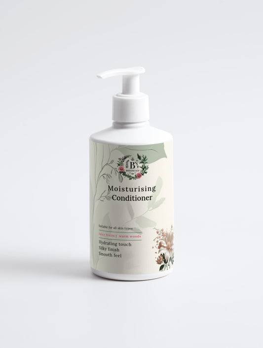 Moisturizing conditioner bottle with pump on a white background