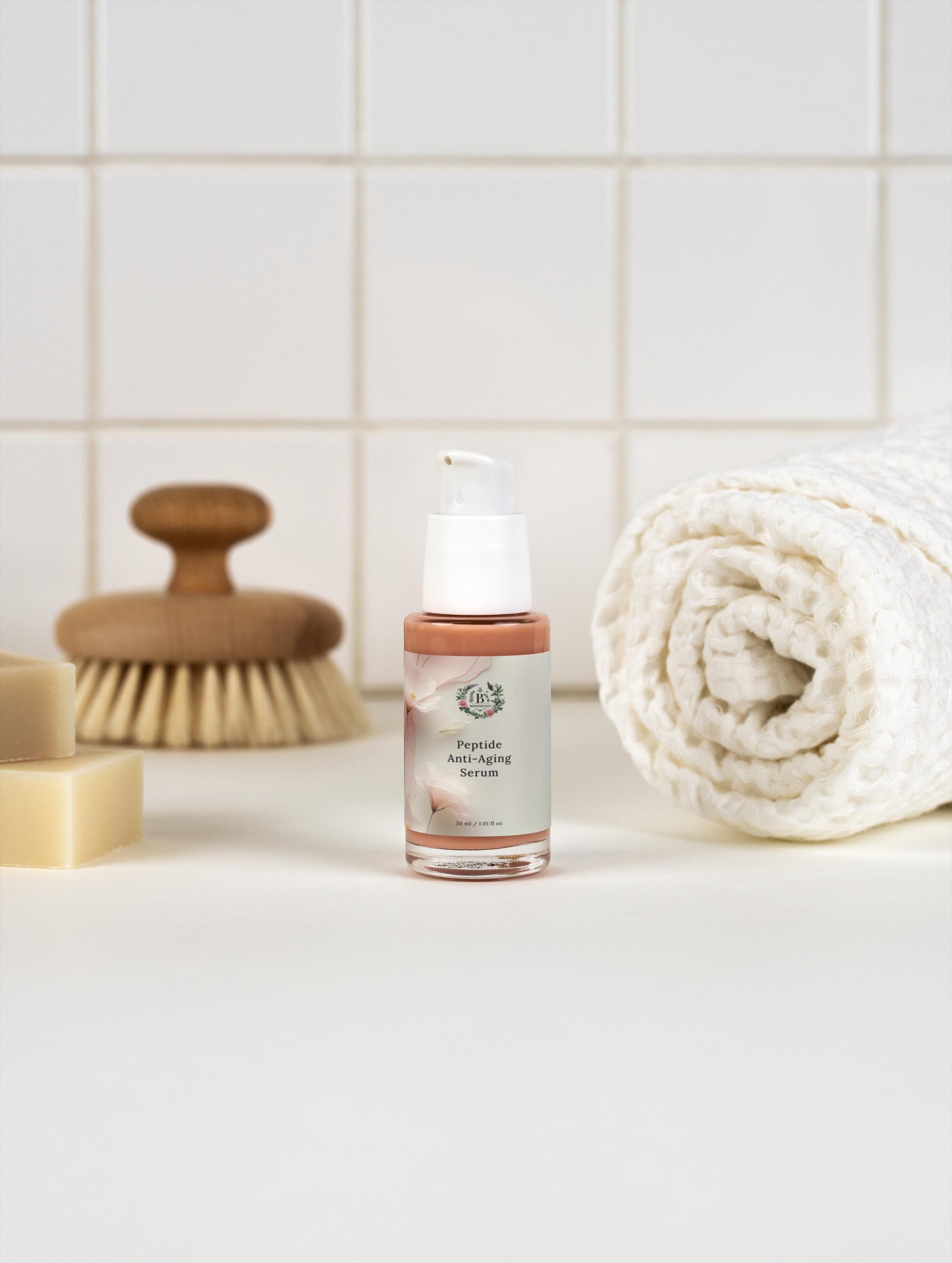 Hydrating peptide face serum designed to reduce fine lines and wrinkles on bathroom shelf