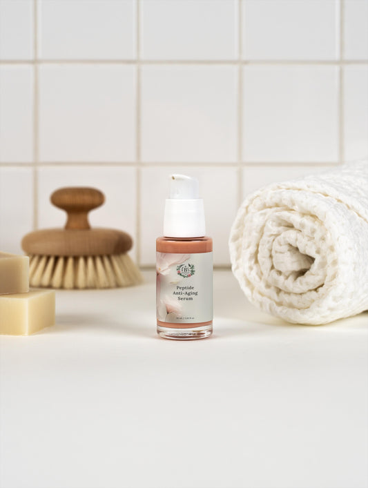 Hydrating peptide face serum designed to reduce fine lines and wrinkles on bathroom shelf