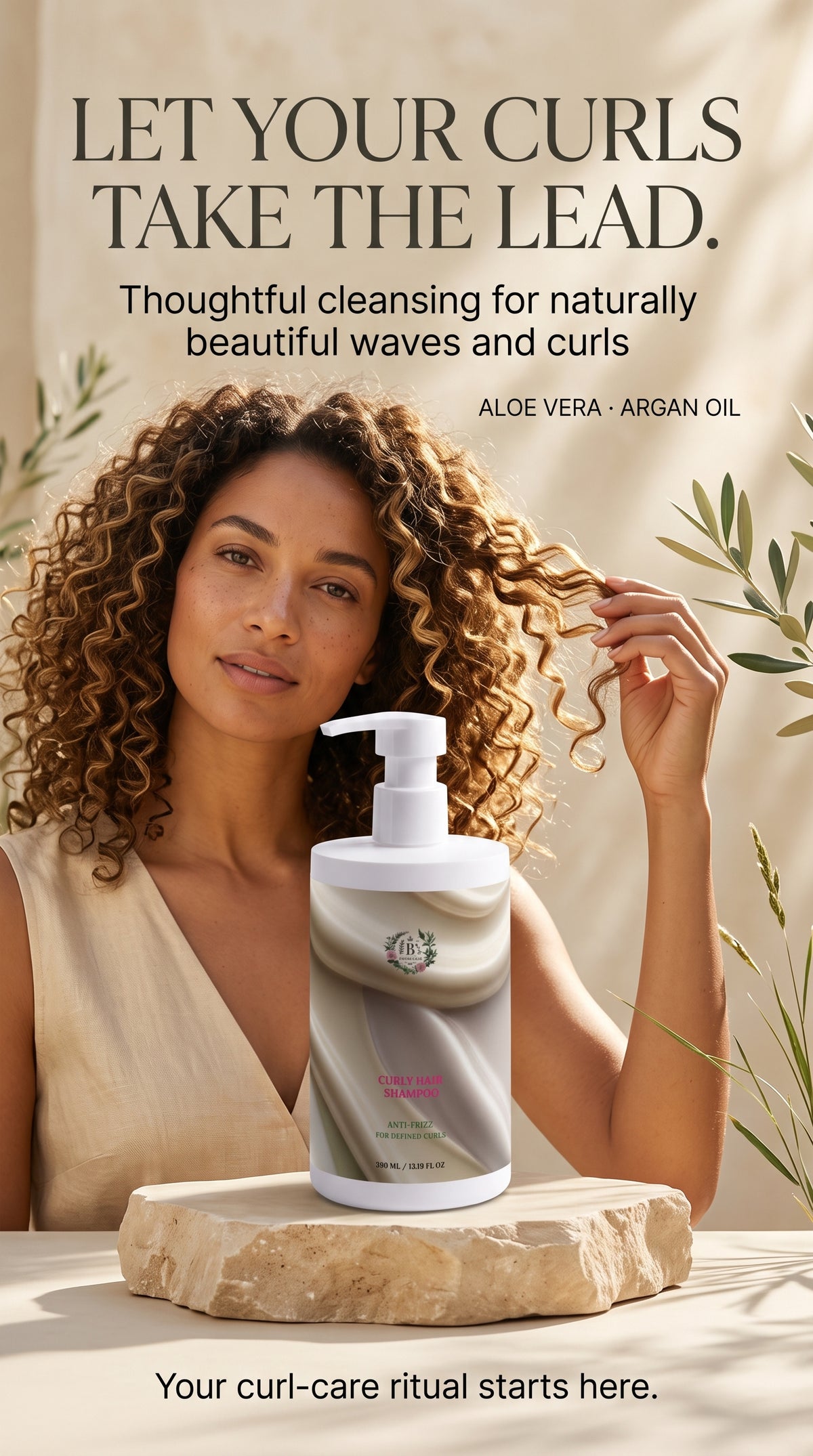A woman with voluminous curly hair sits indoors beside a pump bottle of curl-care product placed on a stone slab. The scene is styled with warm neutral tones, leaves, and large promotional text at the top and bottom.
