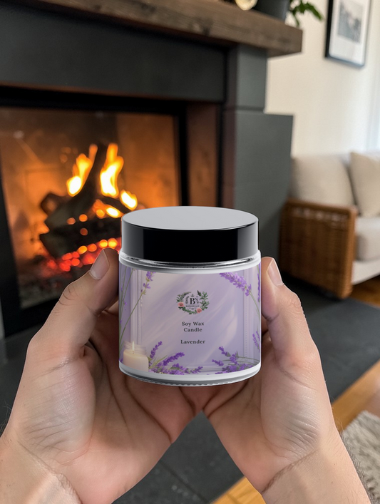 Hand holding a jar of lavender candle in front of a fireplace