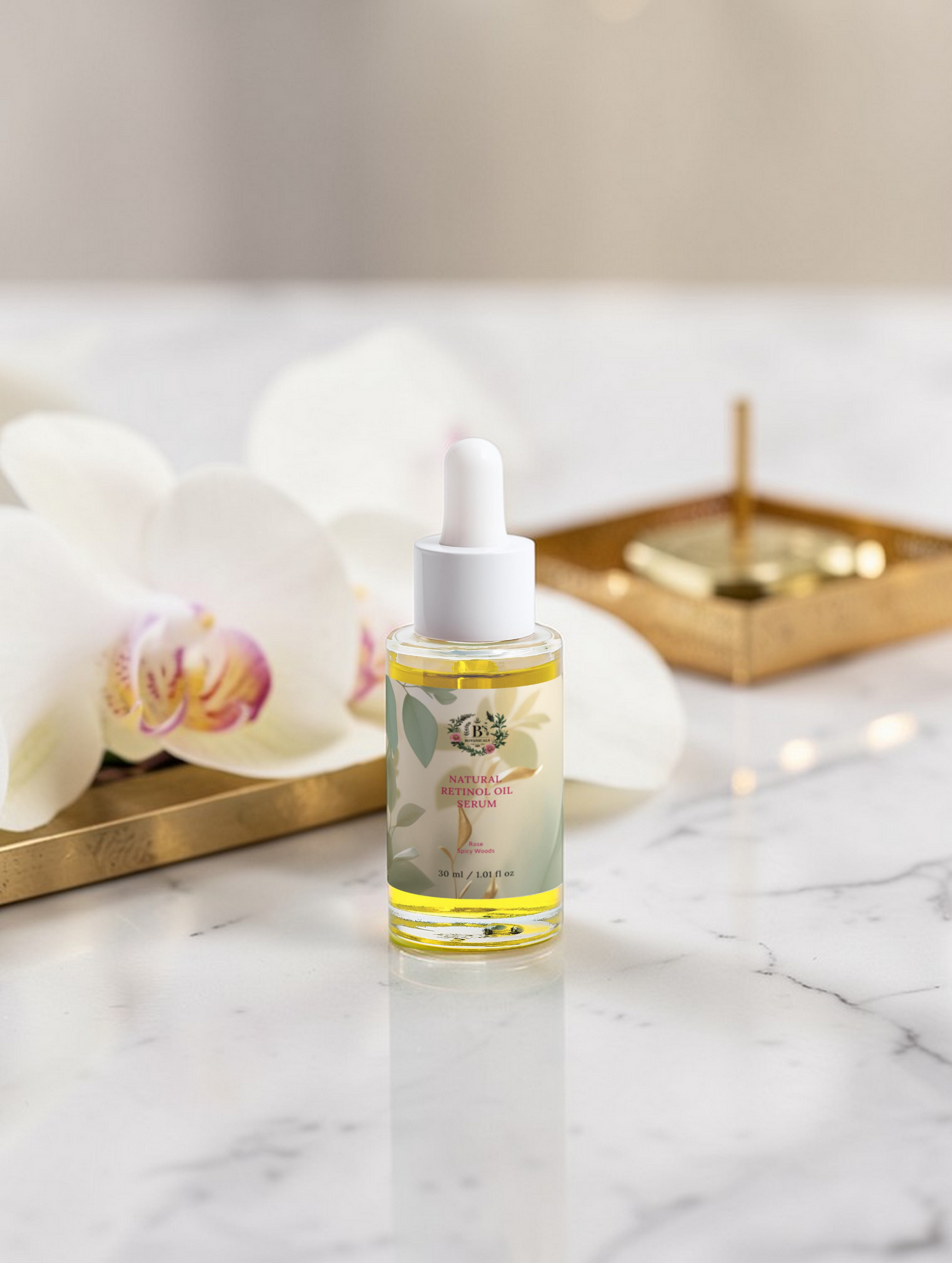 Bottle of skincare serum on a marble surface with decorative elements